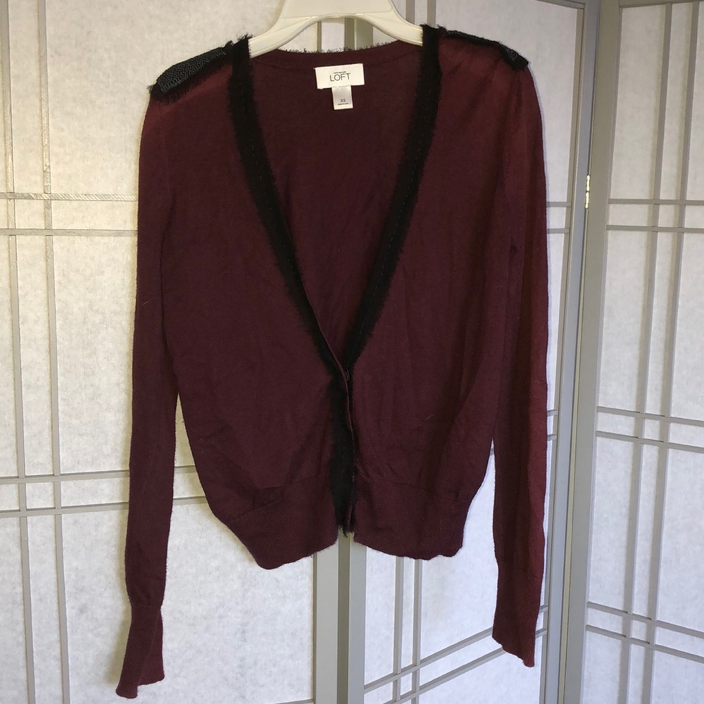 Maroon cardigan with sleek black trim